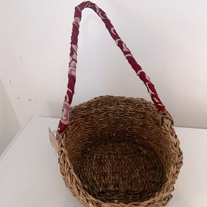 Woven basket with red handle